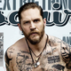Illustration for article titled Scowling, Shirtless, Tattooed Tom Hardy: I Dont Feel Very Manly